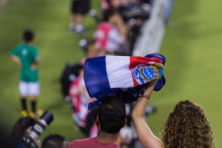 Tampa, Florida - June 02 : Costa Rican soccer fans cheering at the Costa Rica vrs Japan game; June 02 2014 in Tampa Floridaの写真素材