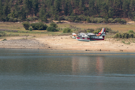 Lost Creek Lake, Oregon  - September 7 : Supperscooper plane after scoping water out of Lost Creek Lake to fight the 790 Fire, September 7 2014 in Lost Creek Lake, Prospect Oregonのeditorial素材