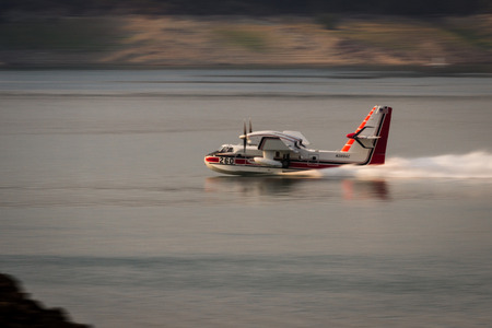 Lost Creek Lake, Oregon  - September 7 : Supperscooper plane scoping water out of Lost Creek Lake to fight the 790 fire, September 7 2014 in Lost Creek Lake, Prospect Oregonのeditorial素材