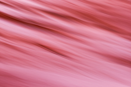 closeup blur of a sandstone wall in the Arizona desert with a slow shutter speed following the natural grain in the rockの写真素材