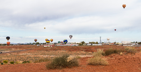 Page Arizona - October 31 : Hot air balloons lifting off in the navajo landscape of Arizona, October 31 2014 in Page, Arizonaのeditorial素材