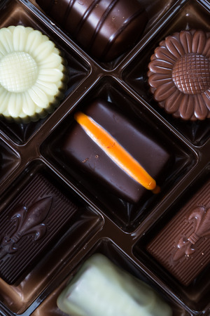 close up of a tray with an assortment of chocolatesの写真素材