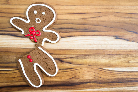 holiday cookie, a gingerbread man broken in half with a scared expressionの写真素材