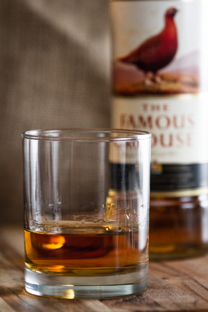 Boulder City Nevada - December 25 : Blended Scotch served neat in a glass with a bottle of The Famous Grouse in the background, December 25 2014 in Boulder City, Nevadaのeditorial素材