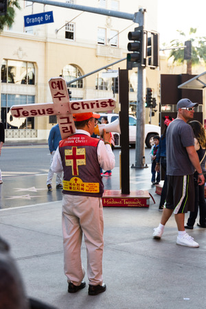 Hollywood Blvd, Hollywood, California - February 08 :Unknown man walking the streets with a religious sign and a megaphone, February 08 2015 in Hollywood Blvd, Hollywood, California.のeditorial素材