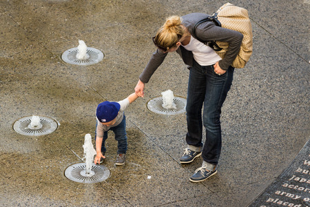 Hollywood & Highland Center, Hollywood, California - February 08 : Child playing in the water fountains, February 08 2015 in the Hollywood & Highland Center, Hollywood, California.のeditorial素材
