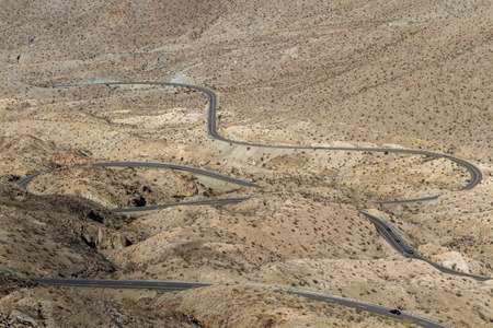 view from above of a windy road thru the desert in southern Californiaの写真素材