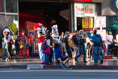Hollywood, California - February 08 : Popeye and Mario working the streets in Hollywood with people walking by, February 08 2015 in Hollywood, California.のeditorial素材