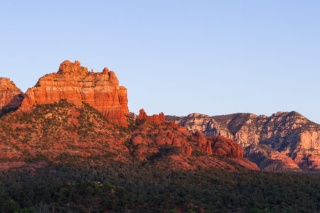 beautiful landscape with red rock formations in the mountains of Sedona Arizona with an orange glow from the setting sunの写真素材