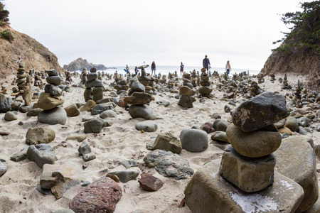 stacked rocks left behind by people as an art form in the California Coastの写真素材