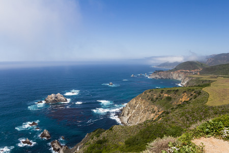 Coastline in California with dramatic rocks and cliffs alongside highway 1の写真素材