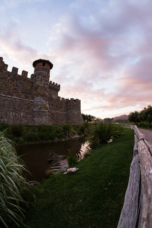 Castle in Napa Valley at sunset with a reflection on the moteのeditorial素材