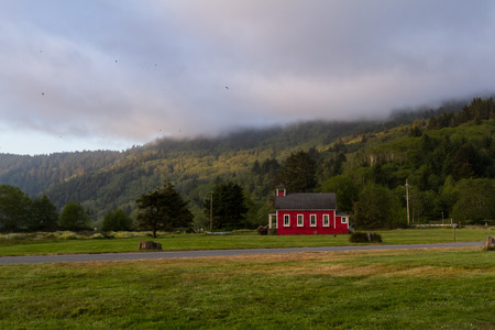 little red school house in a green meadow of northern Californiaのeditorial素材