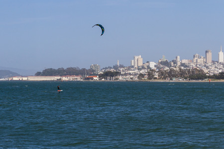 San Francisco, California - May 11 : Kite surfing in the Bay with the city skyline in the background, May 11 2015 San Francisco, California.のeditorial素材