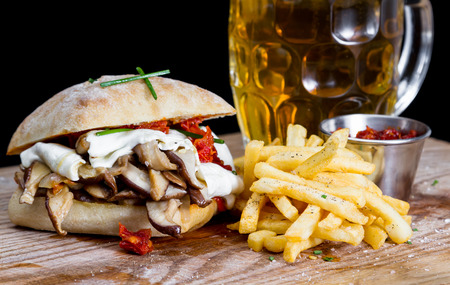 mushroom and cheese sandwich served with a sun dried tomato pesto and french friesの写真素材