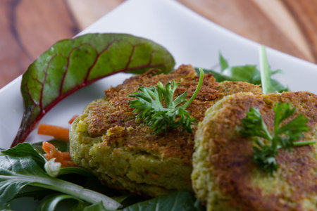 grilled falafels served over a fresh green salad with organic micro greens