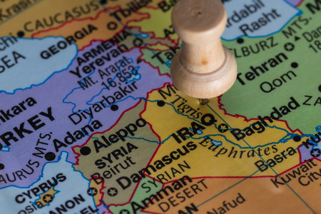 Close up of a world map focused on the country of Iraq as a conceptの写真素材