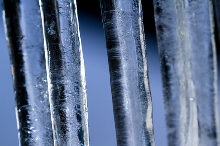 icicles hanging from the roof in an extreme cold and wet winterの写真素材