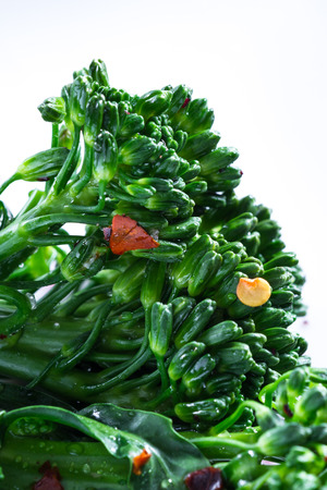 close up of the detail in each fleet in this organic broccolini with colorful seasoningsの写真素材