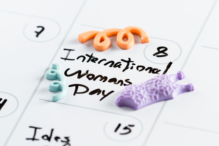 march 8th on a day planner with the words International Woman's Day marked on itの写真素材