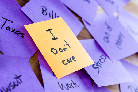 Self help concept image using sticky notes to write lives problems and the solution in a different color rising above the problemsの写真素材