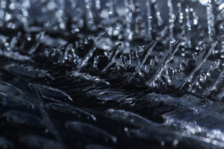 close up of sharp cool looking ice shards in beautiful figures on a cold winter morningの写真素材