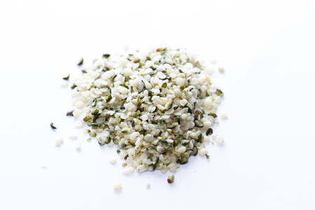 close up of a pile of hemp seeds on a white backgroundの写真素材