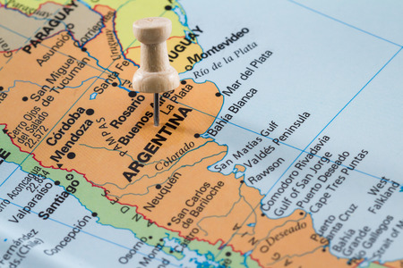 push pin on  a world map marking Argentina  as a destination conceptの写真素材