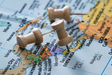 close up of  a map with Costa Rica in focus and a pin marking the spotの写真素材