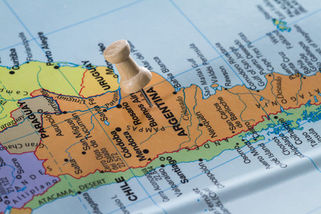 push pin on  a world map marking Argentina  as a destination concept