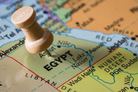 close up of the word Egypt on a world map marked with a push pinの写真素材