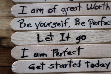 close up of a hand written message on a icesicle stick as a self esteem building conceptの写真素材