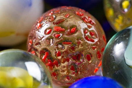 close up of a bunch of marbles in different colors for a background or texture