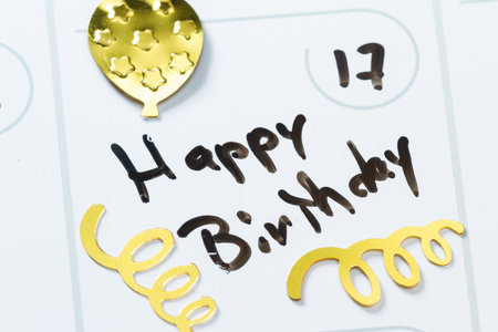 close up of a daily planner or calendar with a hand written message for a birthday celebrationの写真素材