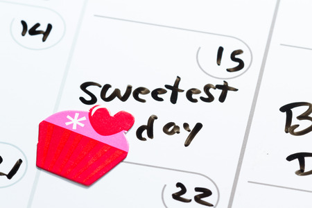 close up of a daily planner or calendar with a hand written message for a celebration or holidayの写真素材