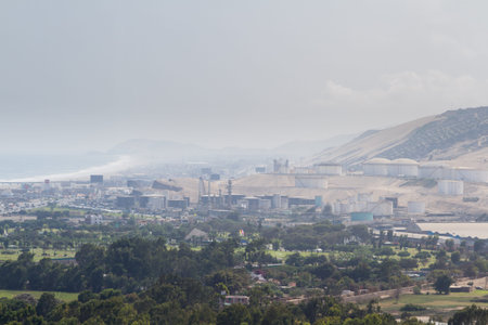Pachacamac, Lima - May 10 : Oil refinery and port near the city of Lima, view with poor air quality...