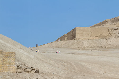 Pachacamac, Lima - May 10 : Tourists walking this spectacular site in the desert of Peru, with great pyramids, dwellings and temples built by different cultures. May 10 2016 Pachacamac, Lima Peru.のeditorial素材