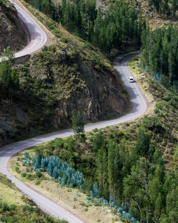 mountain road with curves and steep incline in the mountains of Peruの写真素材
