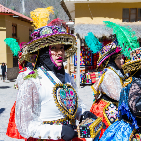 Ollantaytambo, Peru - May 16 : Religious celebration for Fiestas de Pentecostes with people wearing masks and colorful clothing on the streets of Ollantaytambo. May 16 2016, Ollantaytambo Peru.のeditorial素材