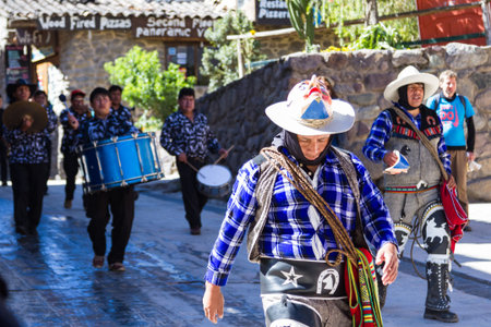 Ollantaytambo, Peru - May 16 : Religious celebration for Fiestas de Pentecostes with musicians marching on the streets of Ollantaytambo. May 16 2016, Ollantaytambo Peru.のeditorial素材