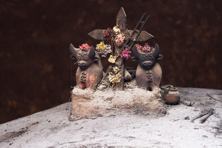 clay bulls and cross as an ornament found in many Peruvian homes as a symbol for good luck and fertilityの写真素材