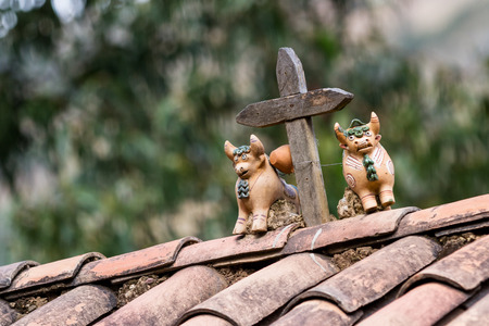 clay bulls and cross as an ornament found in many Peruvian homes as a symbol for good luck and fertilityの写真素材