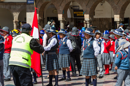 Cusco, Peru - May 12 : School children in uniform in a civic parade celebrating National Independence, parade known as the swearing of the School Police. May 12 2016, Cusco Peru.のeditorial素材