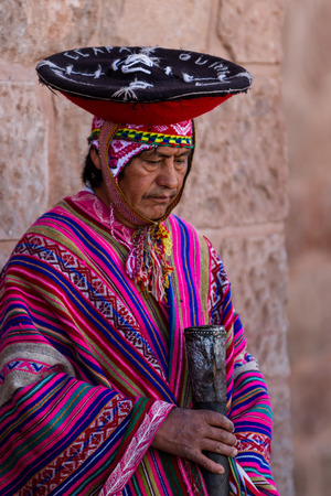 Pisac, Peru - May 15: Quechua elders in traditional clothing in a small ceremony in the Pisac Market. May 15 2016, Pisac Peru.のeditorial素材