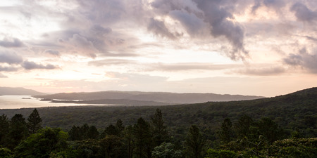 tranquil scene of Arenal Lake as the sun sets in San Carlos, Costa Ricaの写真素材