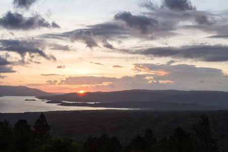tranquil scene of Arenal Lake as the sun sets in San Carlos, Costa Ricaの写真素材