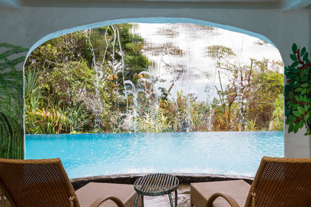 Heredia, Costa Rica - May 01 : relaxing swimming pool with a water fall in a tropical setting. May 01 2016 Heredia, Costa Rica.のeditorial素材