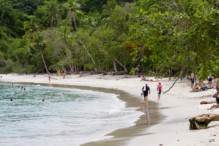 Manuel Antonio, Costa Rica - May 06: People enjoying the warm water in this protected beach. May 06 2016 Manuel Antonio, Costa Rica.のeditorial素材