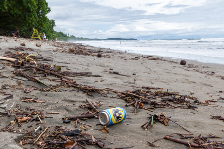 Uvita, Costa Rica - May 04: Empty beer can laying in the sand in a beach In Costa Rica. May 04 2016 Uvita, Costa Rica.のeditorial素材