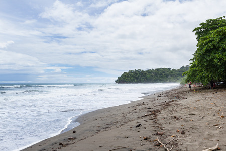 Uvita, Costa Rica - May 04: Beach scene in the south pacific of Costa Rica with couples and families enjoying the warm water. May 04 2016 Uvita, Costa Rica.のeditorial素材